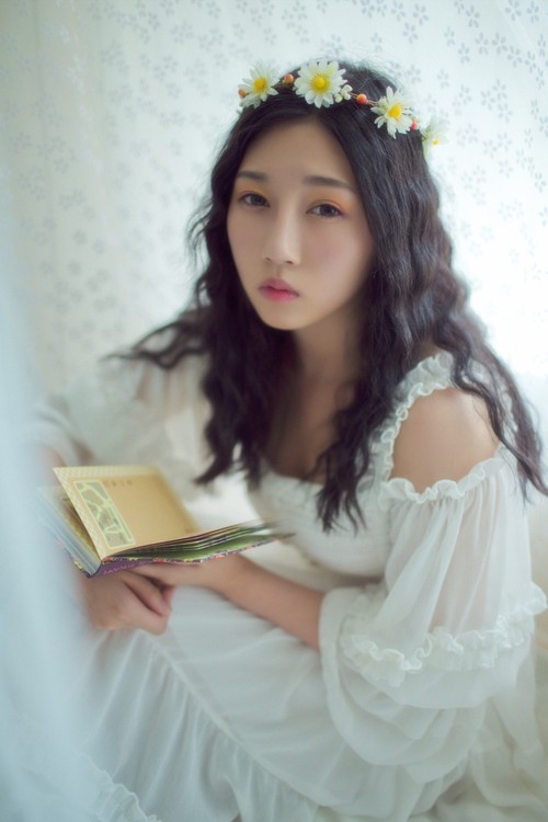 你的美丽却透出淡淡的忧伤